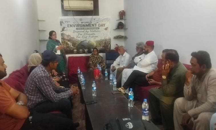 Resource person presenting during community dialogue