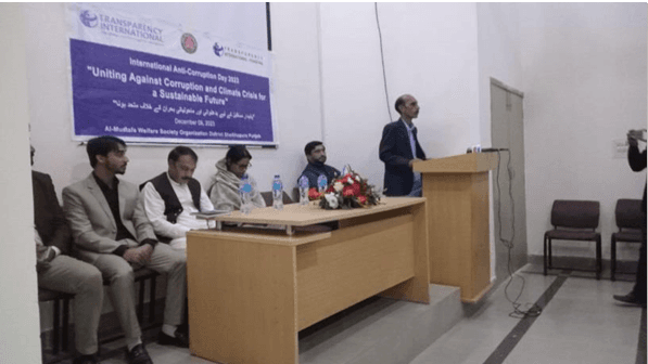 Panelists seated at anti-corruption and climate seminar table