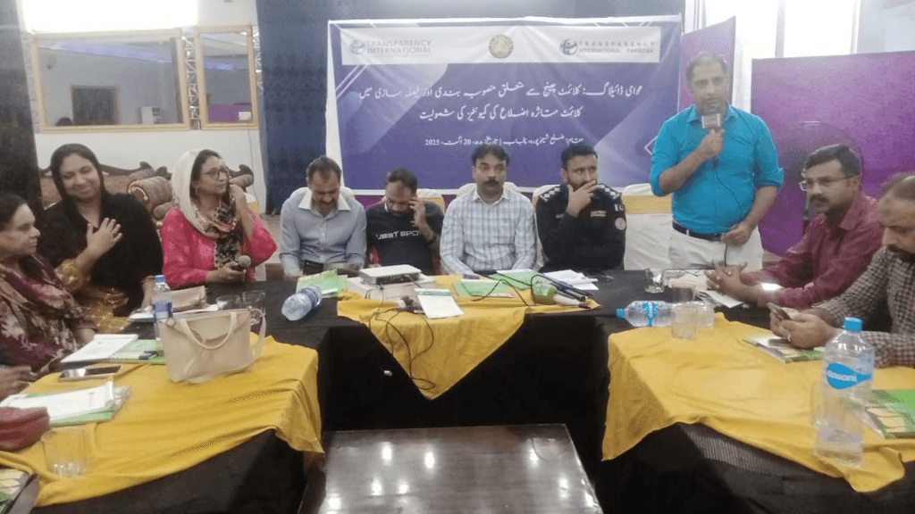 Climate Dialogue speaker in blue shirt addressing public