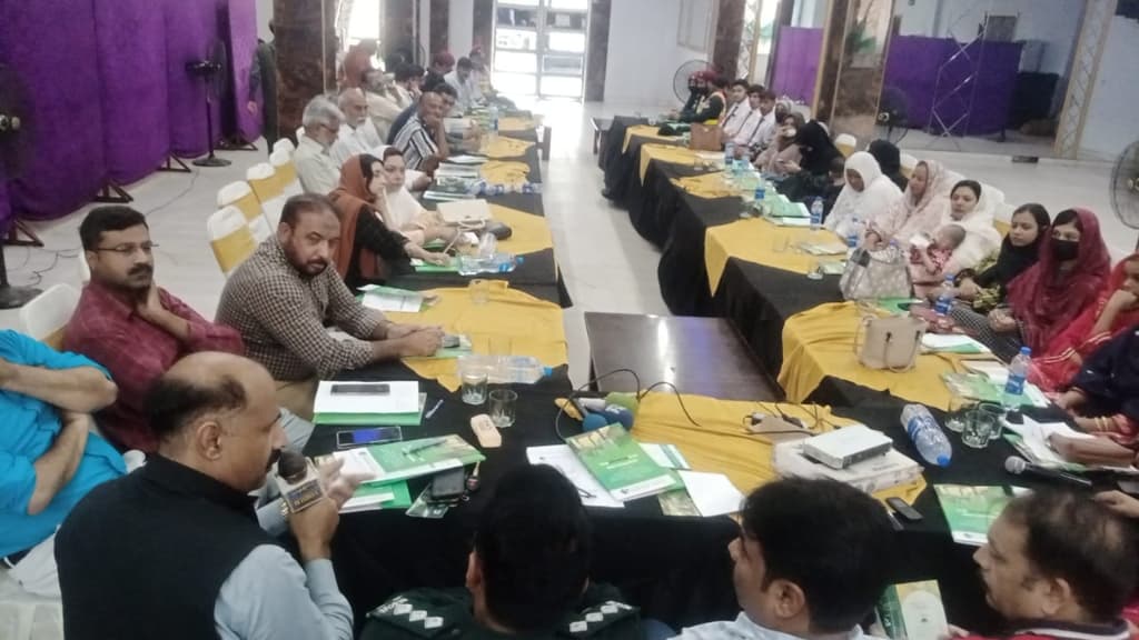 Overview of Choudhry Event Hall with participants seated at tables