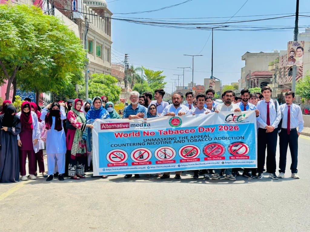 Students and organizers holding the Tobacco Control walk banner